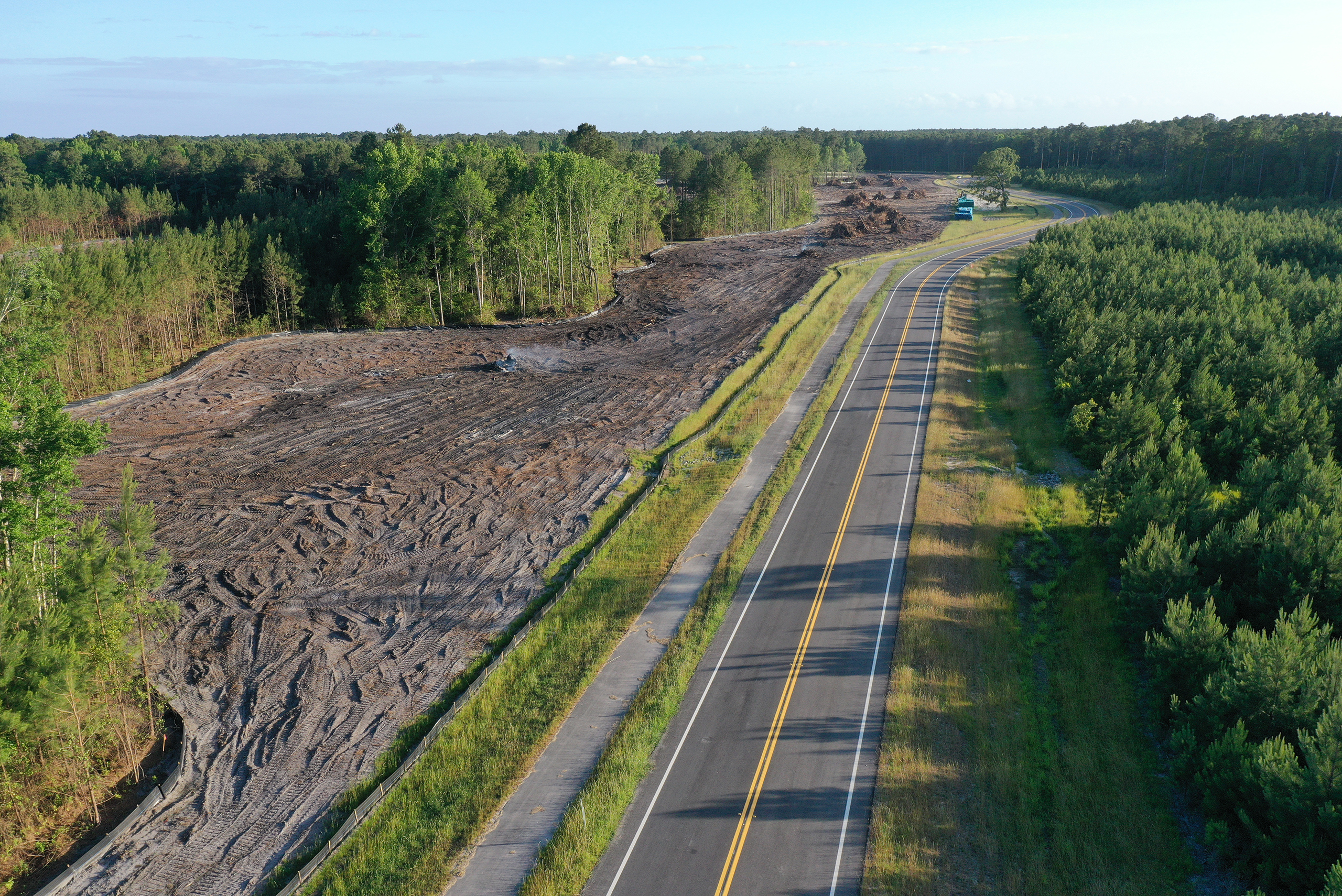 aerial with a roadway and trees